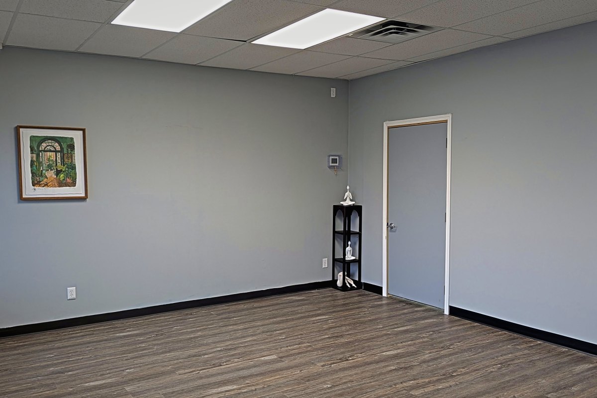 Private back room with plank flooring